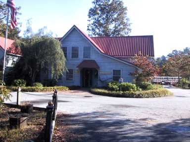 The pro shop, housed in the property's original barn with its red metal roof.